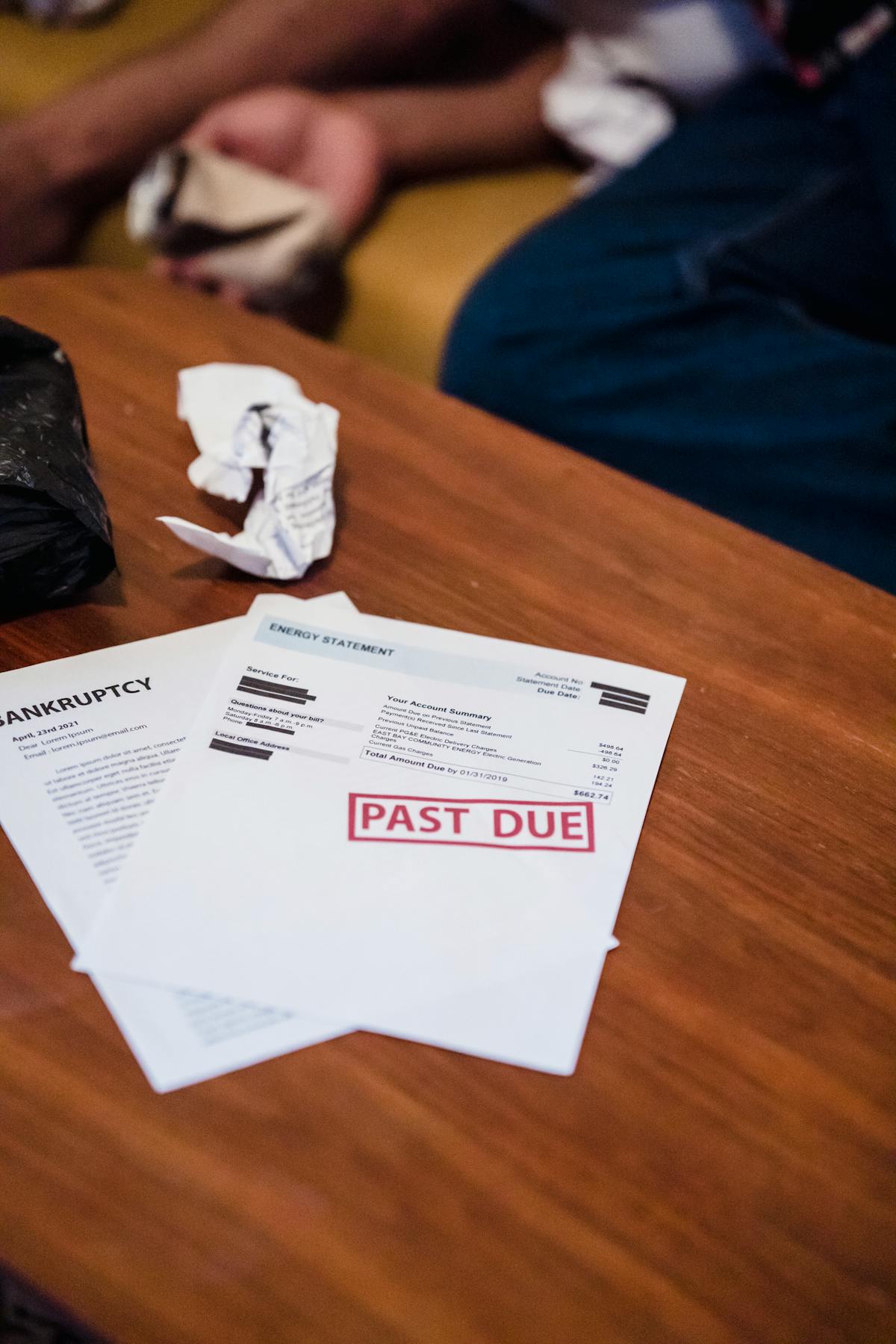 Debt collection documents on table